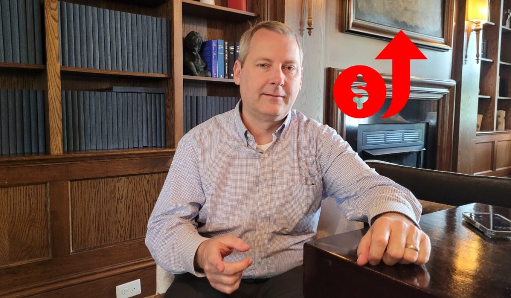 Person pointing at the reader with a "too much money" symbol next to him