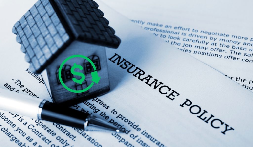 Toy building on a insurance policy paper