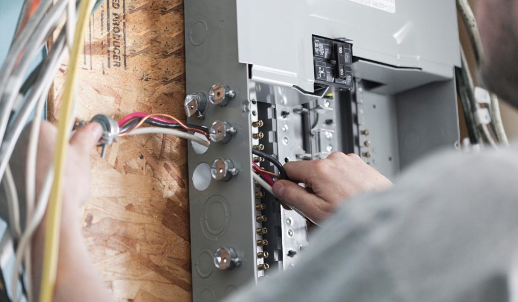 Electrician upgrading a home's breaker