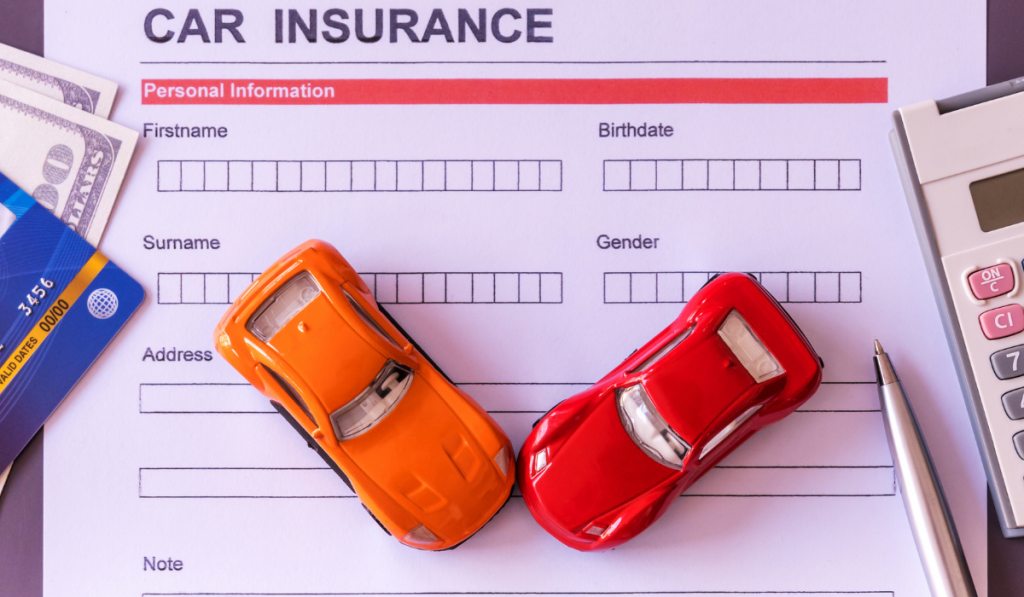 Toy cars on a "Car Insurance" paper
